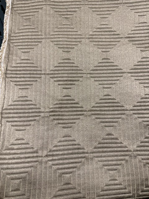 Tonal quilted geometric grid fabric