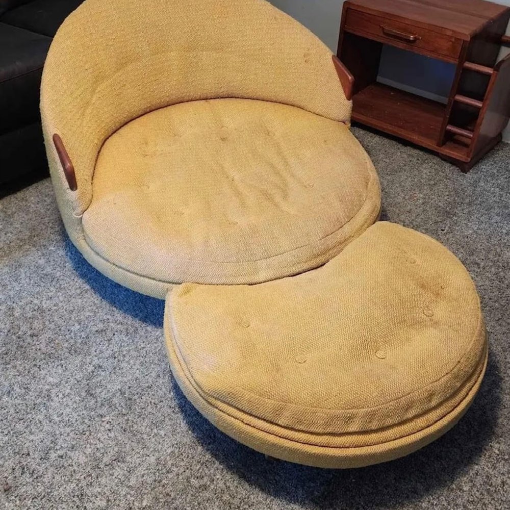 Worn round swivel lounge chair and ottoman before restoration
