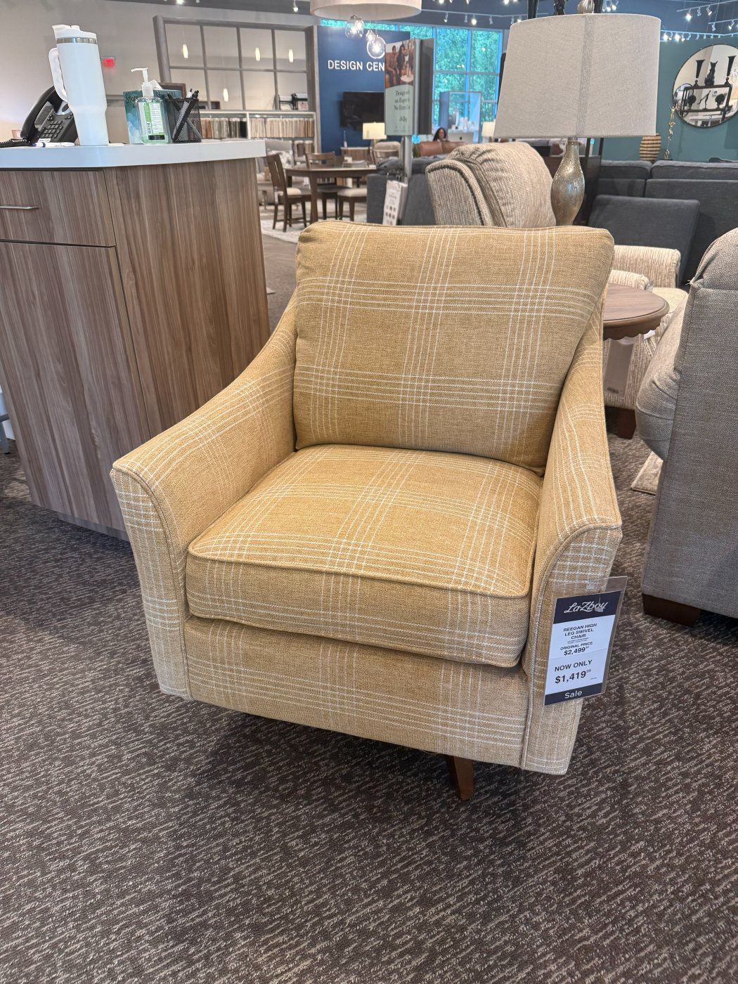 Buttery-yellow plaid swivel chair on the sales floor